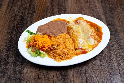 Two enchiladas under red salsa ranchera and melted cheese, plated with Mexican rice, refried beans and a salad.